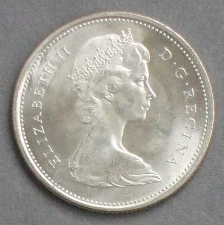 Color photo: Obverse view of 25 cent coin - Canada 1945