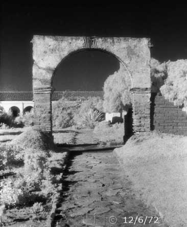 B/W infrared photo: Path and archway to mission - Embedded text: 12/6/72