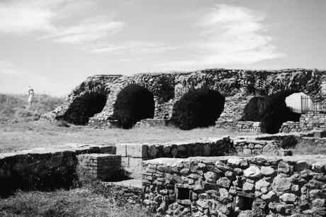 Arched (4) ruins with foundation ruins in foreground