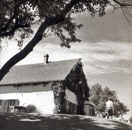 grayscale photograph: side view of house