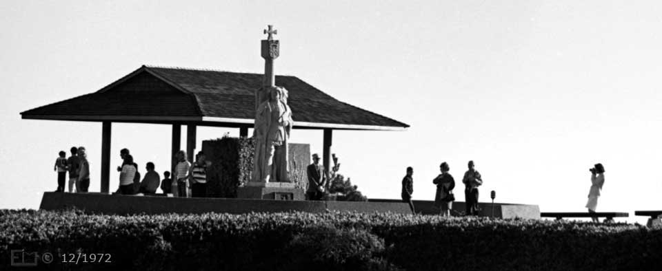 B/W photo: Tourists around Juan Rodriguez Cabrillo statue - Embedded text: 12/1972