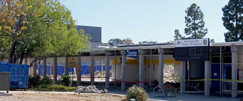 View of old bookstore/cafeteria buildings, with most walls removed, so they can be seen through to other side