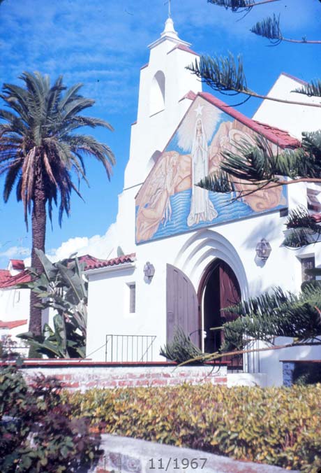E6 color photo - Portrait (oblique) view of church entrance - Embedded text: 11/1967