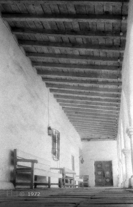 B/W infrared photo: Arcade walkway with beam ceiling - Embedded text: 1973