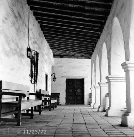 B/W photo: Arcade walkway with beam ceiling - Embedded text: 11/23/72