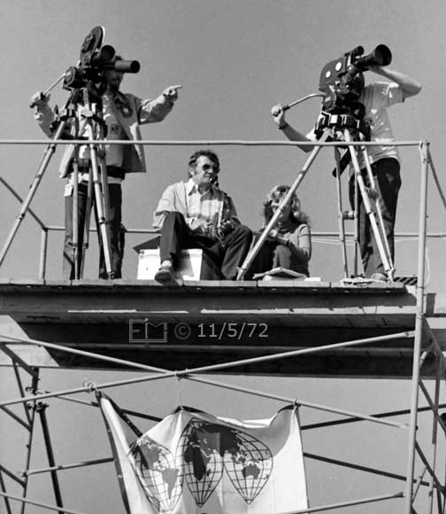 B/W photo: Movie crew atop scafold filming race - Embedded text: 11/5/72