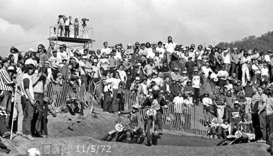 B/W photo of racers negotiating turn in racetrack - Embedded text: 11/5/72