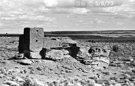 B/W photo of sunlit side of ruin and its surroundings - Embedded text: 5/8/73