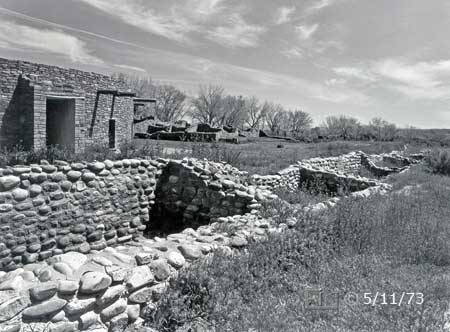 B/W photo: South-side view of ruins and reconstructed (1934) Great Kiva - Embedded text: 5/11/73