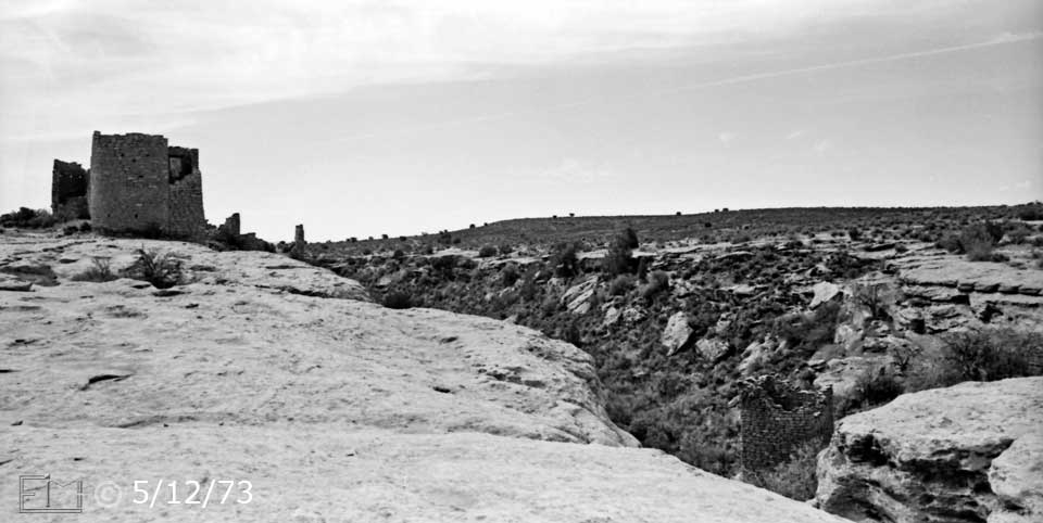 B/W photo: View of mesa top with ruins in distance - Embedded text: 5/12/73