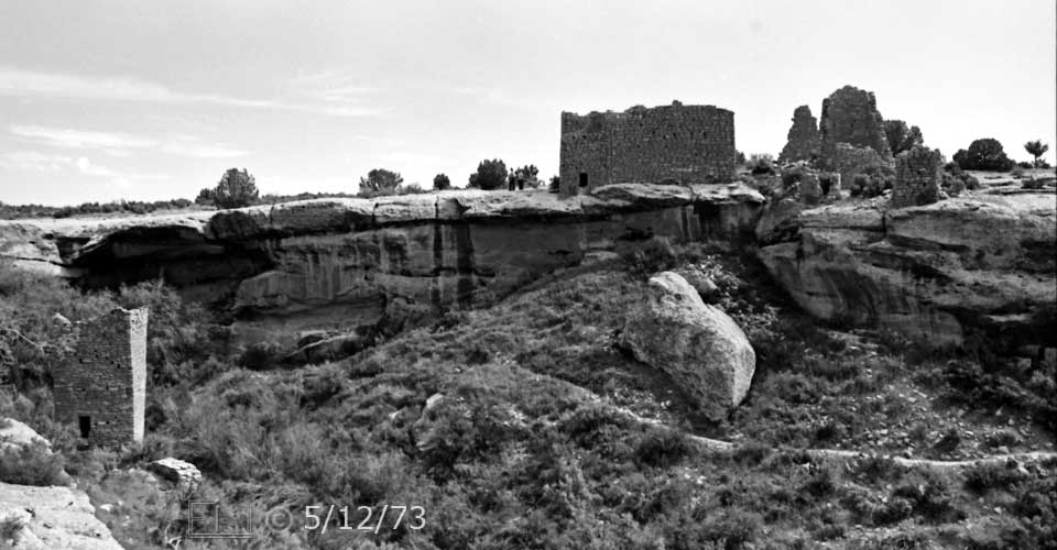 B/W photo: View of canyon, Square Tower ruin,canyon wall and ruins on mesa above - Embedded text: 5/12/73