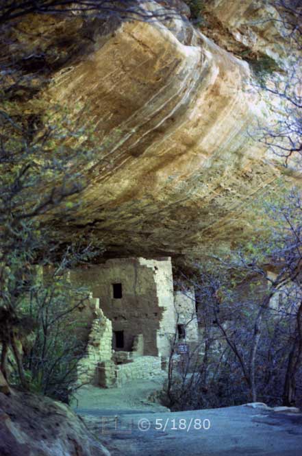 Color photo: Side portrait view of cliff dwelling ruins and overhanging cliff - Embedded text: 5/18/80