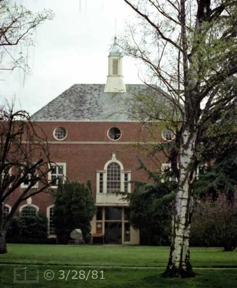 Color photo: An old historic building with lawn and large (birch?) tree in foreground - Embedded text: 3/28/81