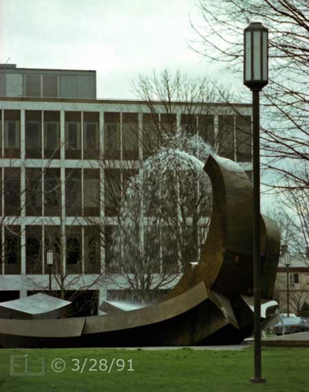 Color photo: Portrait view of distinctive water fountain and its environment - Embedded text: 3/28/81