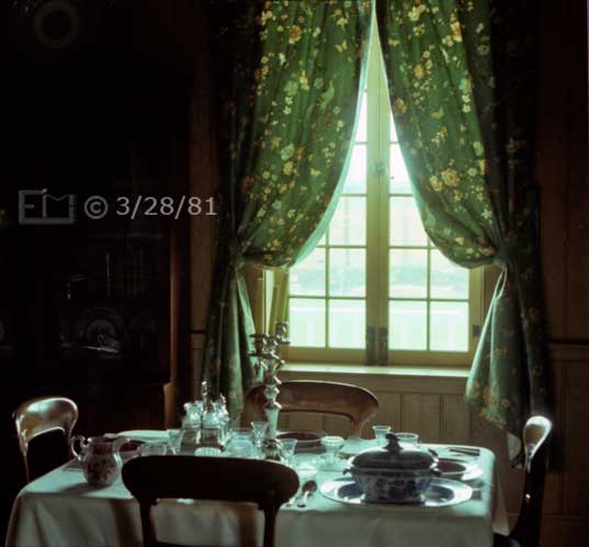 Color photo: Window lit table set for dining by 4 - Embedded text: 3/28/81