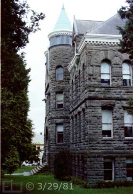 Color photo: Oblique, portrait view of  old, stone, multi-story building - Embedded text: 3/29/81