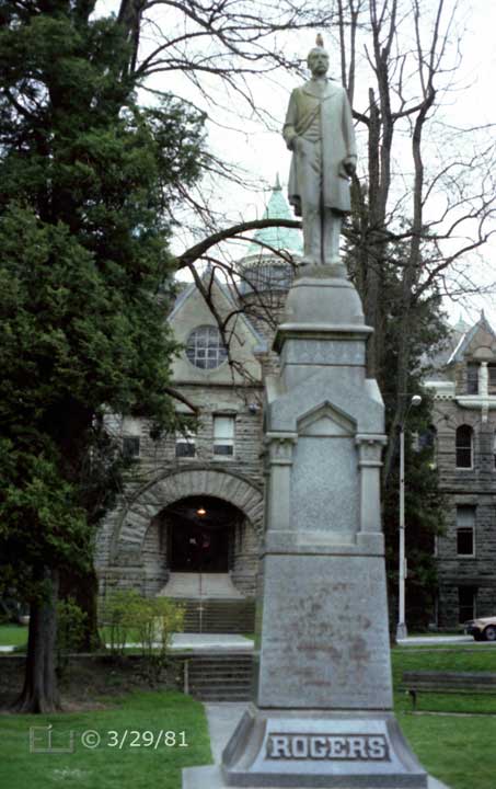 Color photo: Frontal view of statue and stone building in background - Embedded text: 3/29/81