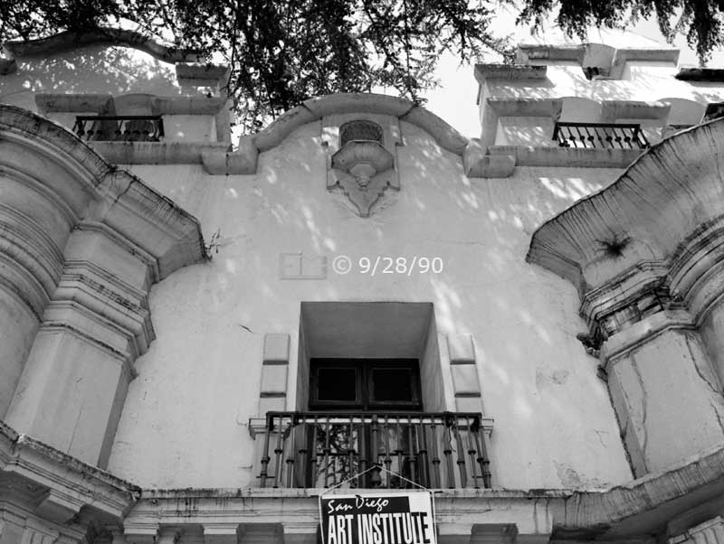 B/W photo: Tilted, upward view of SD Art Institute's building facade - Embedded text: 9/28/90