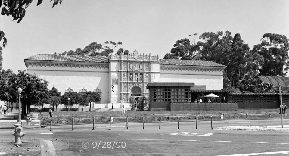 B/W photo: Wide view of SD Museum of Art from across street with Usonian Home and grounds temporally replacing parking lot - Embedded text: 9/28/90