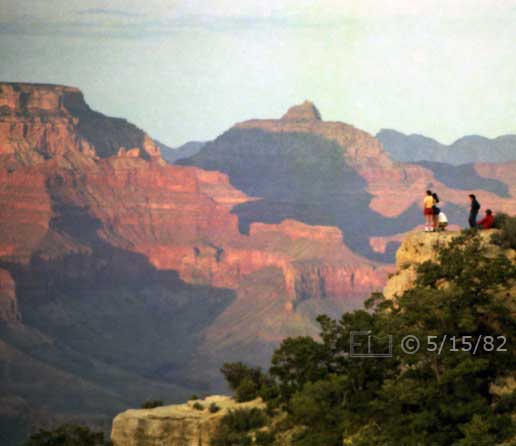 Color photo: Sunset lit view of Grand Canyon with spectators atop unguarded overlook - Embedded text: 5/15/82