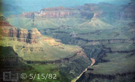 Color photo:  Landscape view of Colorado River and its Grand Canyon surroundings - Embedded text: 5/15/82