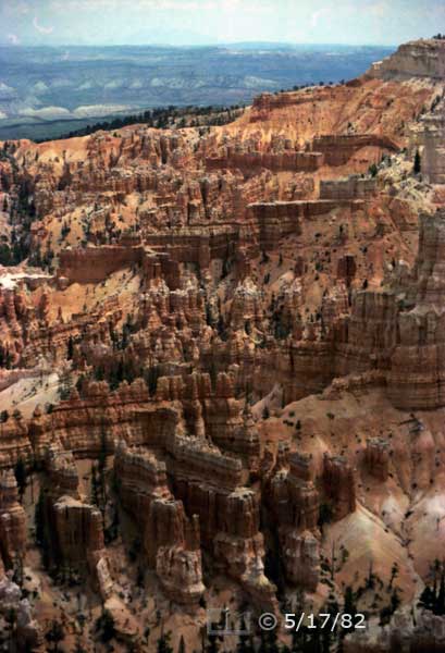Color photo:  Repeating rock walls in foreground of chaotic eroded rock landscape - Embedded text: 5/17/82