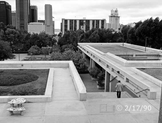 B/W photo: View from upper floor of 'A' building of connecting stair-way and skyline to the West - Embedded text: 2/17/90