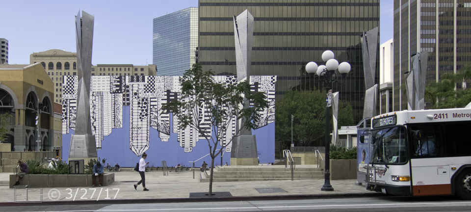 Color photo: View of a pedestrian on the edge of an ornamental waterworks pool - Embedded text: 3/27/17