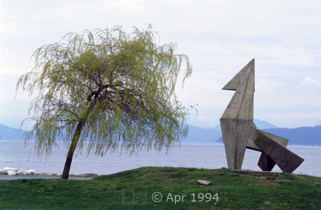 Color photo: Tree and sculpture in Stanley Park - Image taken: 4/7~12/1994