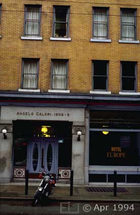 Color photo: Motorcycle parked in front of ''Hotel Europe'; an older building - Image taken: 4/7~12/1994