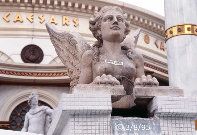 Color photo: Statues and waterfall at 'Caesars Palace' - Embedded text: 3/8/95