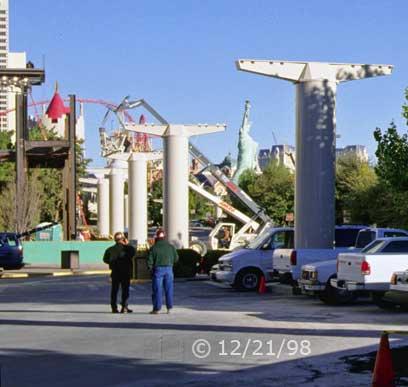 Color photo: View of support pillars for under construction inter-casino elevated tramway - Embedded text: 12/21/98