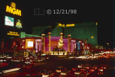 Color photo: Nighttime view of MGM Entertainment Complex and Las Vegas Blvd - Embedded text: 12/21/98