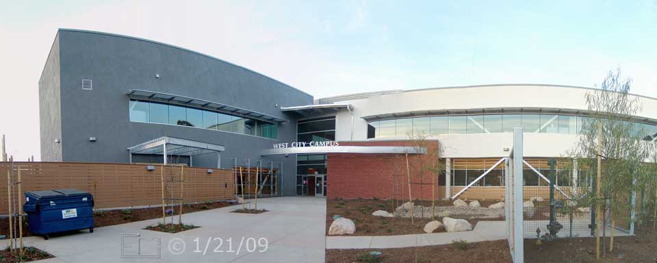 Color photo: Wide, cylindrical view of west entrance of new West City Campus building- Embedded text: 1/21/09