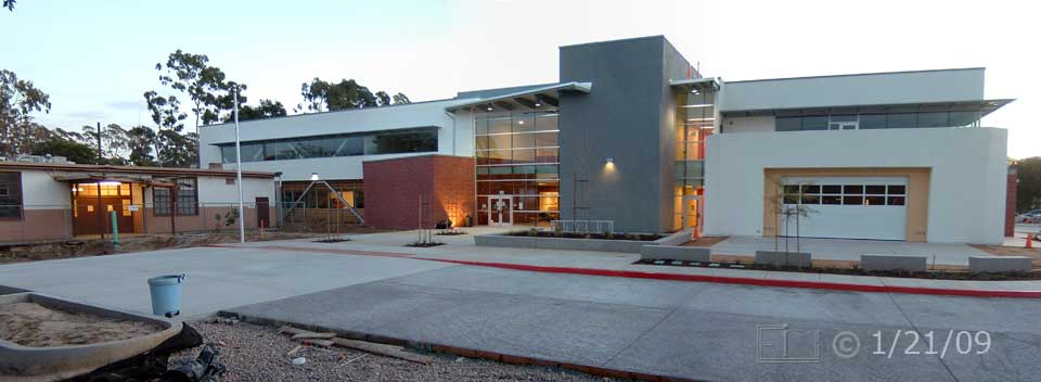 Color photo: Wide view, looking east, of old and new West City buildings - Embedded text: 1/21/09