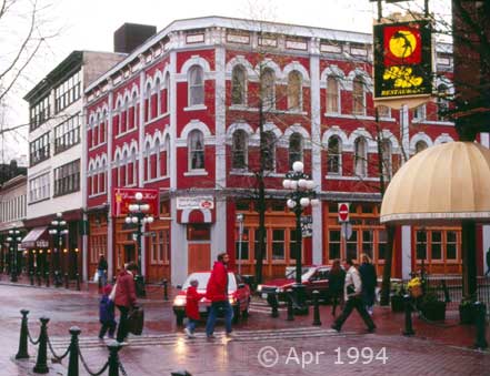 Color photo: Pedestrians crossing Gaslamp Street in crosswalk - Image taken: 4/7~12/1994