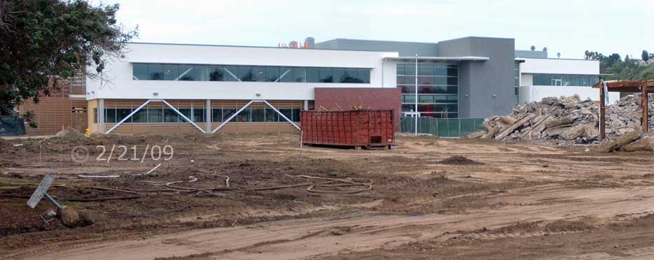 Color photo: View across open field of new West City Campus building - Embedded text: 2/21/09