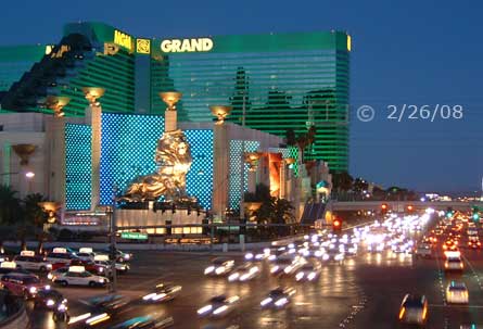 DSC color photo: Nighttime east view of MGM Grand and Tropicana Blvd from pedestrian overpass - Embedded text: 2/26/08