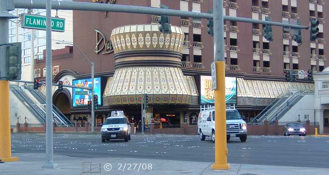 DSC color photo: View of Bill's across intersection with pedestrian overpass staircases/escalators on right and left margins of image - Embedded text: 2/27/08