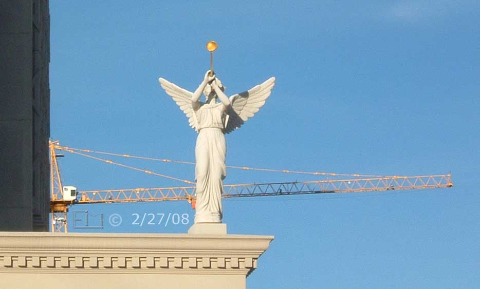 DSC color photo: View of Carsars Palace angel blowing horn with construction crane in background  - Embedded text: 2/27/08