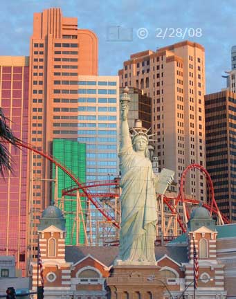 DSC color photo: Statue of Liberty and NYNY skyline during sunrise  - Embedded text: 2/28/08