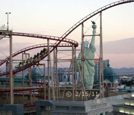 DSC color photo: Statue of Liberty and Rollor Coaster atop NYNY - Embedded text: 2/15/11