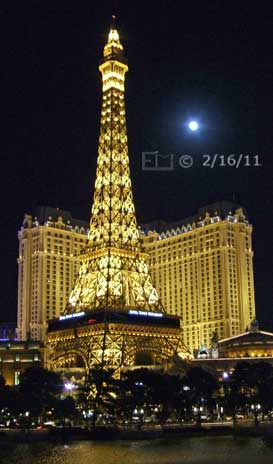 DSC color photo: Nighttime view of 'Paris' from across water in front of the Bellagio - Embedded text: 2/16/11