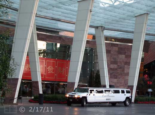 DSC color photo: Stretch limo in front of Aria entrance - Embedded text: 2/17/11