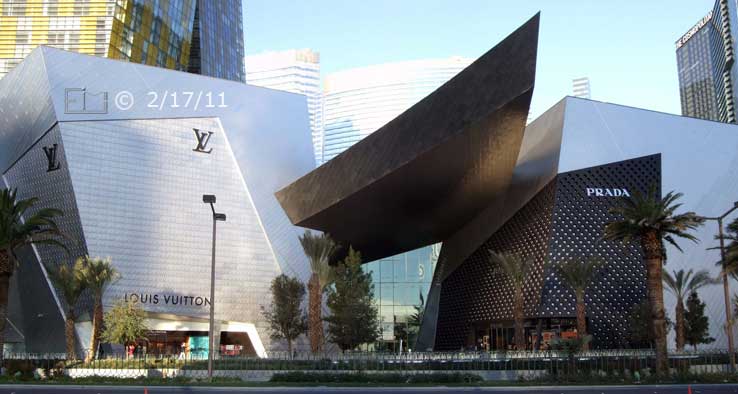 DSC color photo: Louis Vuitton and Prada buildings viewed from across Las Vegas Blvd - Embedded text: 2/17/11