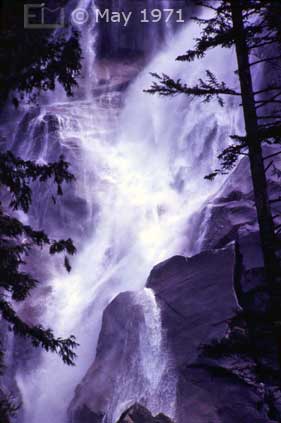 Color photo: Portrait view of a waterfall - Lynn Canyon? North Vancouver - Embedded text: May 1971