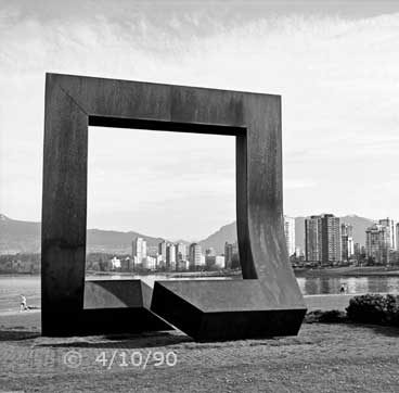 B/W photo: A construction zone alogn side tramway tracks - Embedded text: 4/10/90