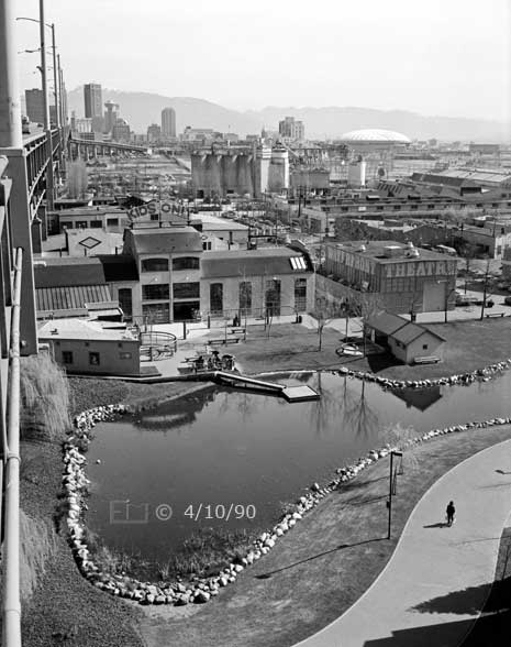 B/W photo: Elevated view of Granville Island from Granville Bridge - Embedded text: 4/10/90