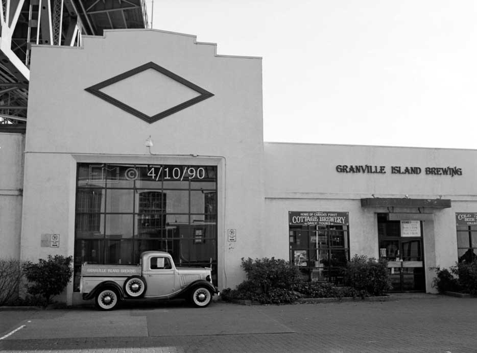 B/W photo: Granville Island Brewing with vintage pick-up truck in front - Embedded text: 4/10/90