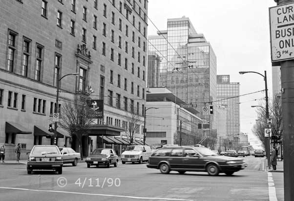 B/W photo: Hotel Vancouver and its reflection on the glass wall of a nearby building - Embedded text: 4/11/90